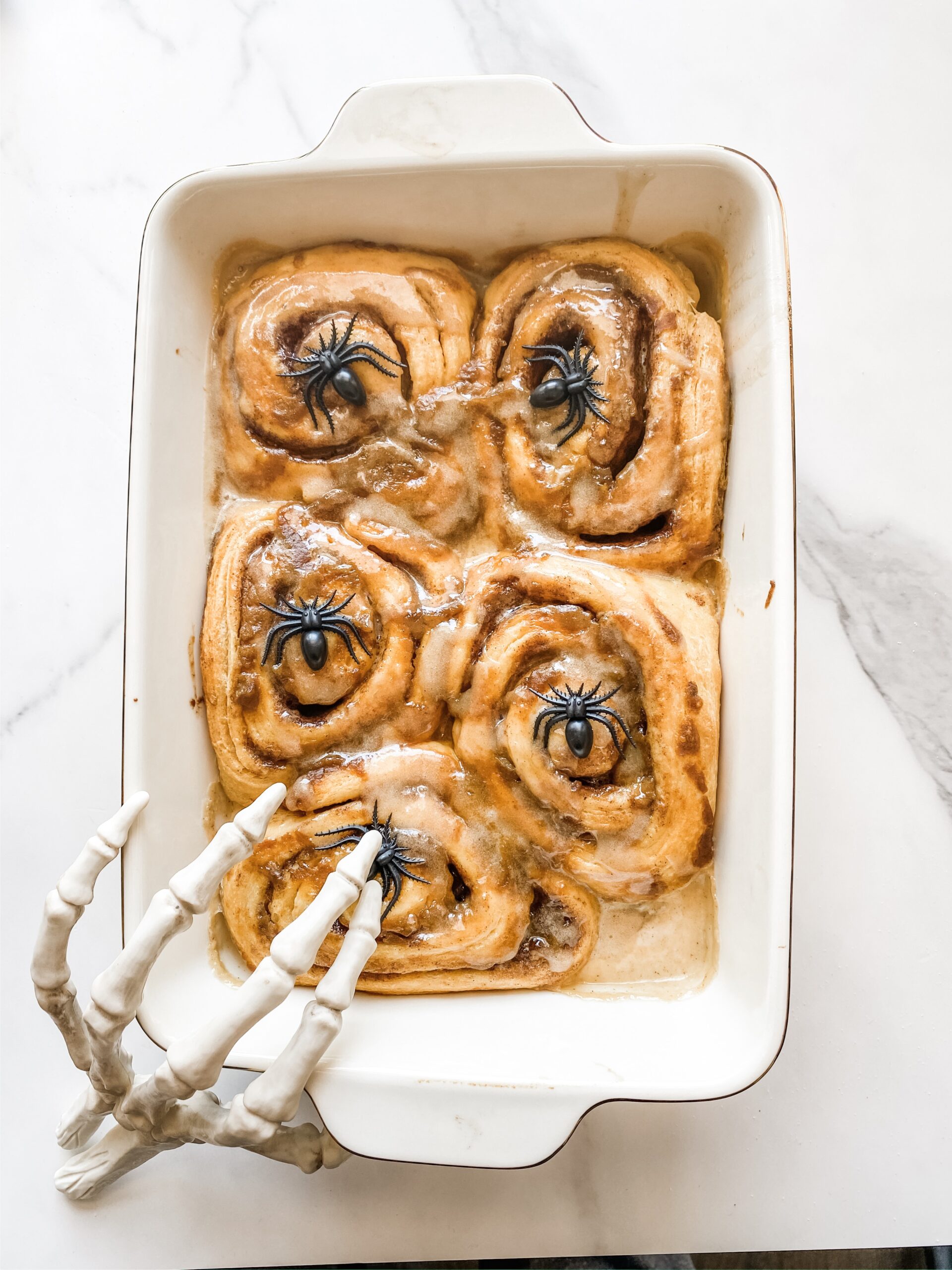 Pumpkin cinnamon rolls with orange icing